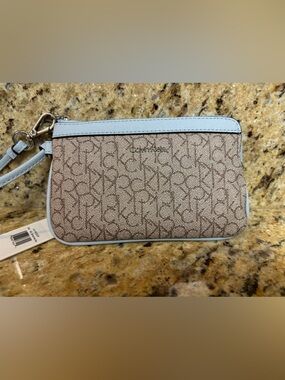 Calvin Klein Brown Monogram Wristlet with Light Blue Trim